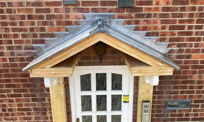 front door with lead flashing around the top